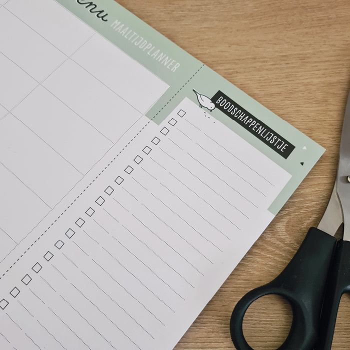 Close-up van rechtse gedeelte maaltijdplanner waarop een afknipbaar boodschappenlijstje gedrukt is. 